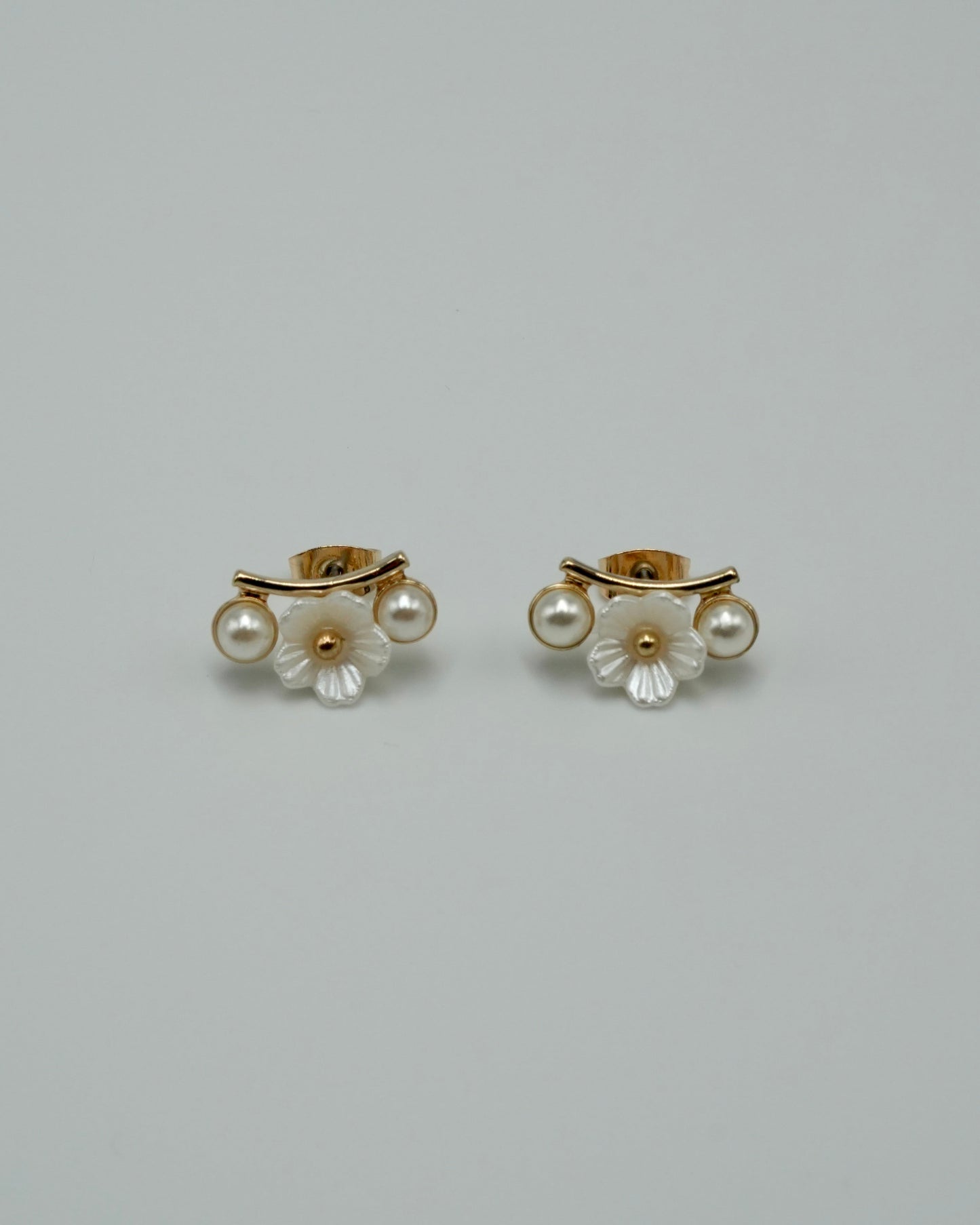 between flower pierce & earring