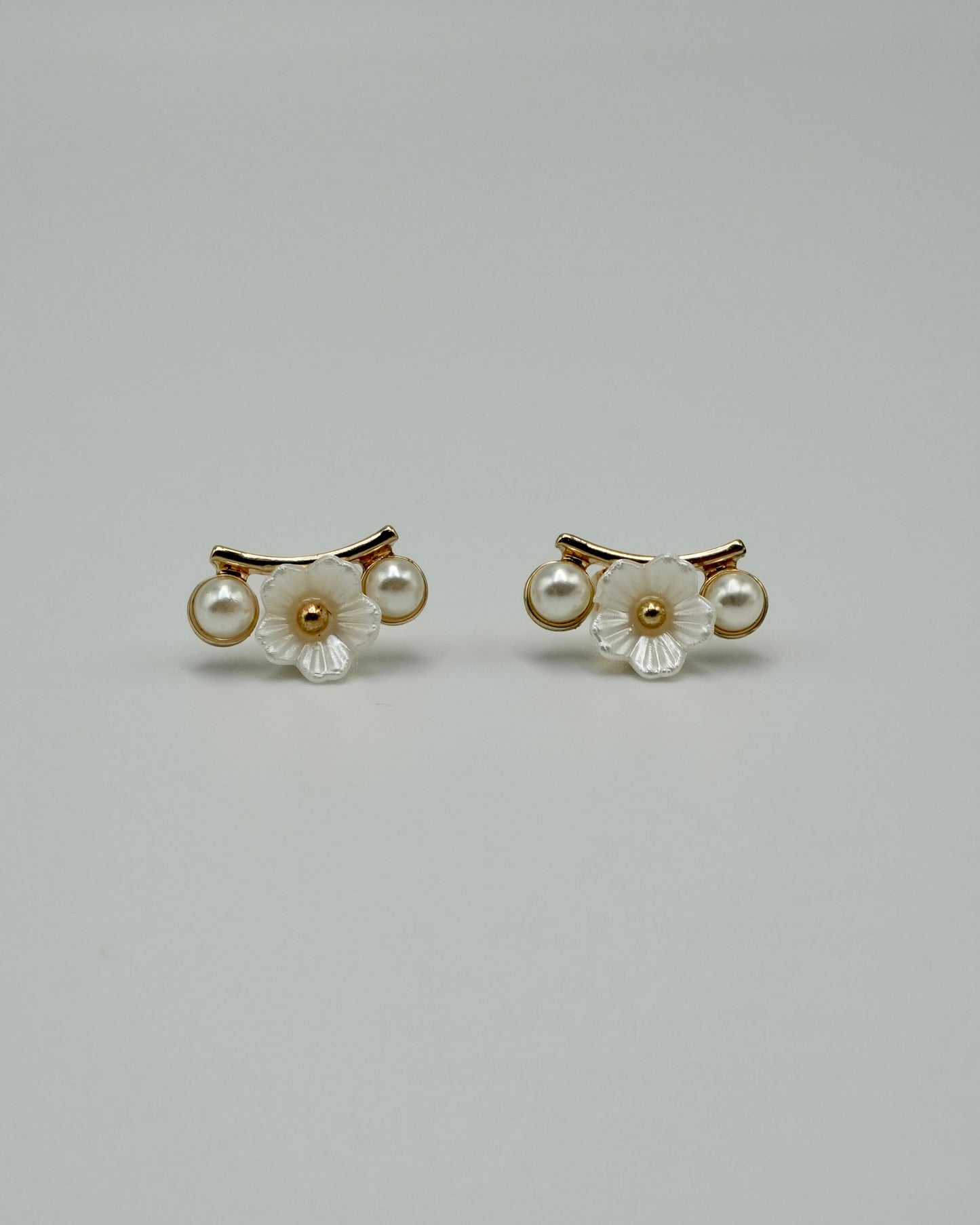 between flower pierce & earring