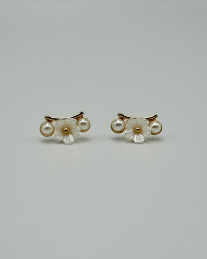 between flower pierce & earring
