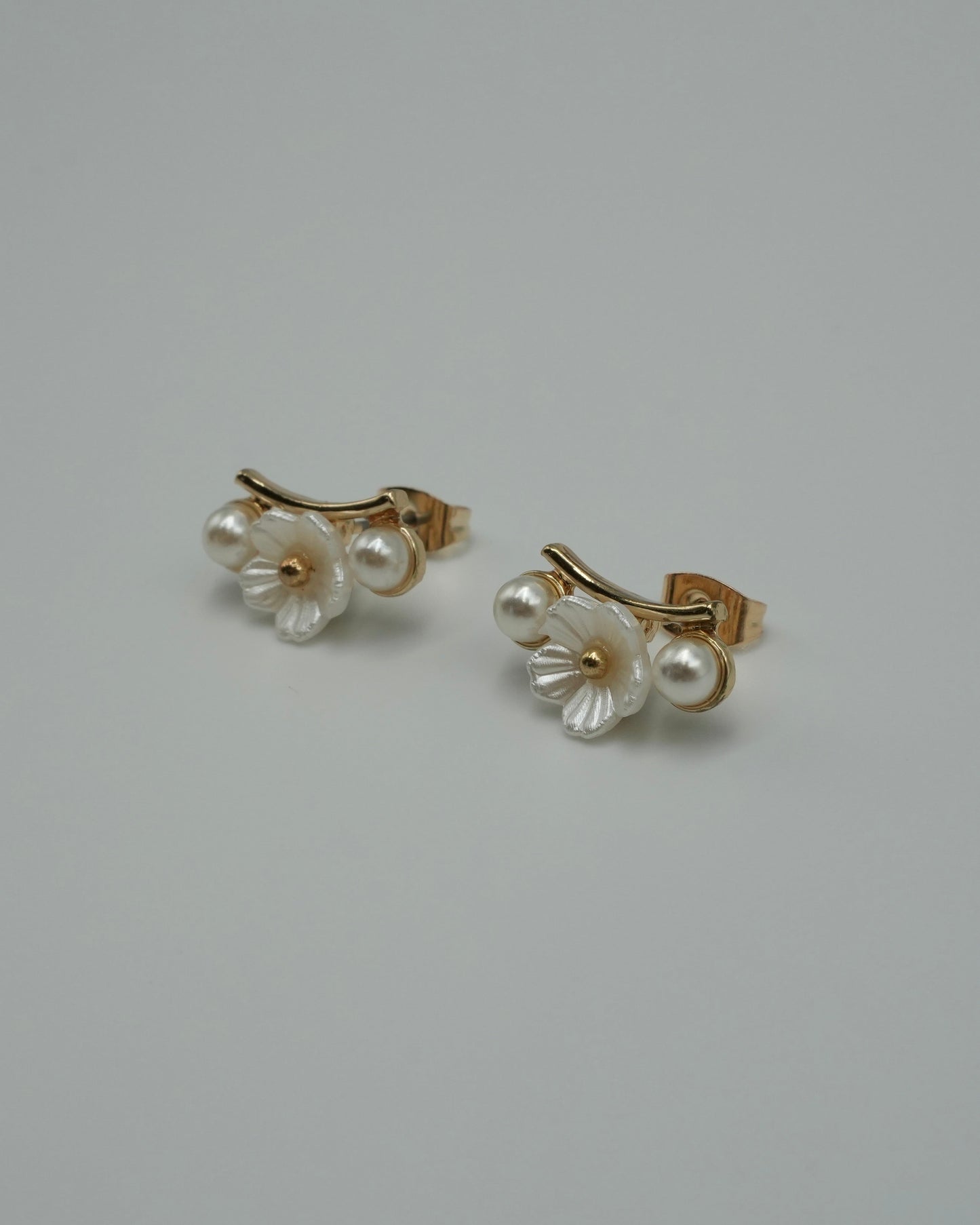 between flower pierce & earring