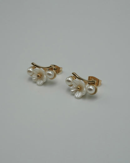 between flower pierce & earring