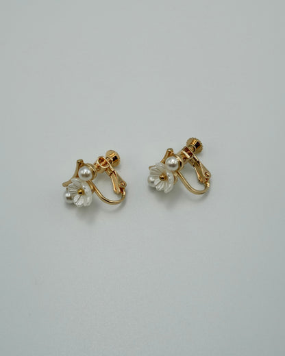 between flower pierce & earring